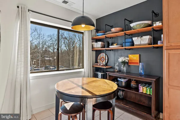 a view of a room with furniture and window