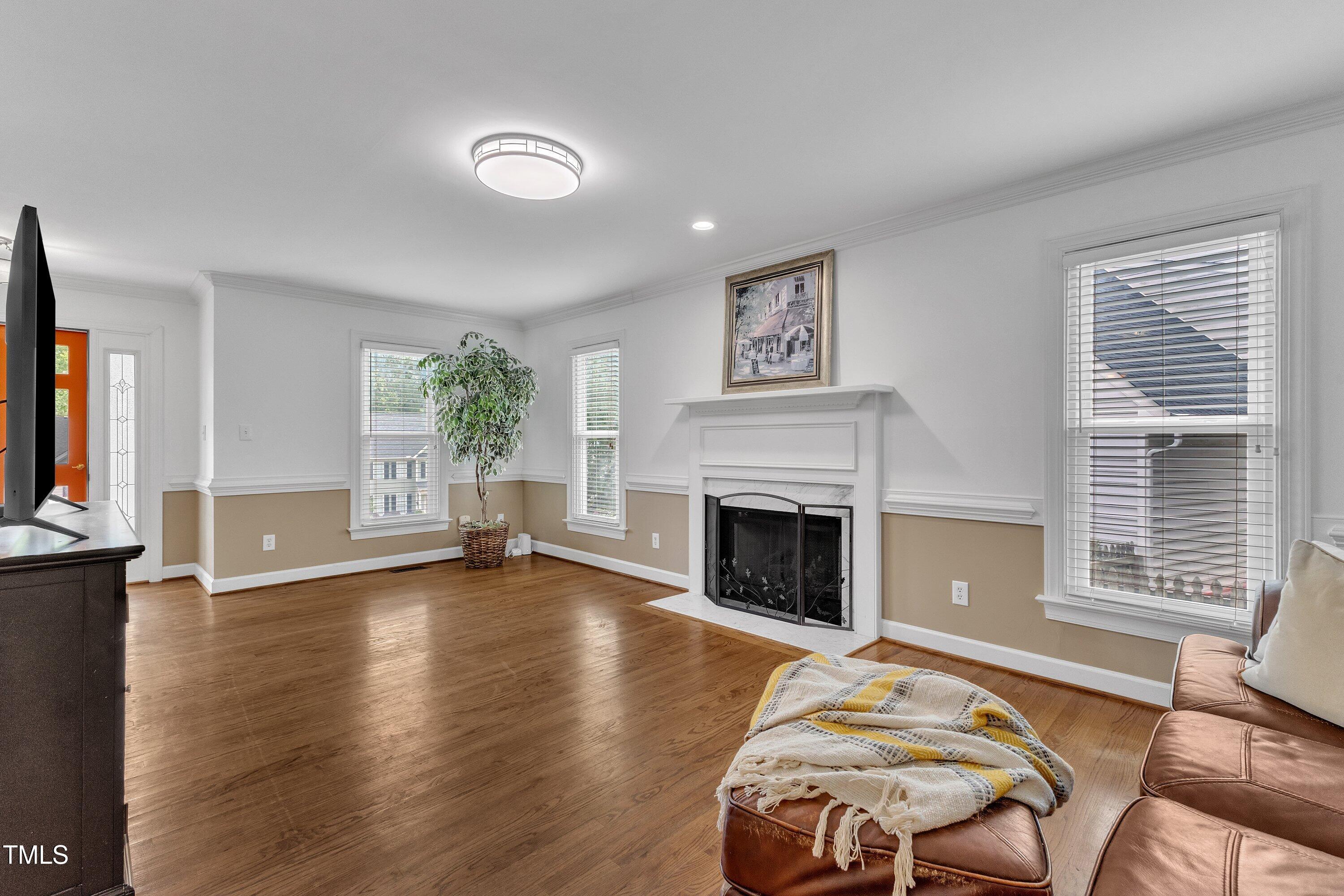 2721 Dahlgreen Road Raleigh, NC 27615 - Photo 8 of 59 a spacious bedroom with a bed and a fireplace