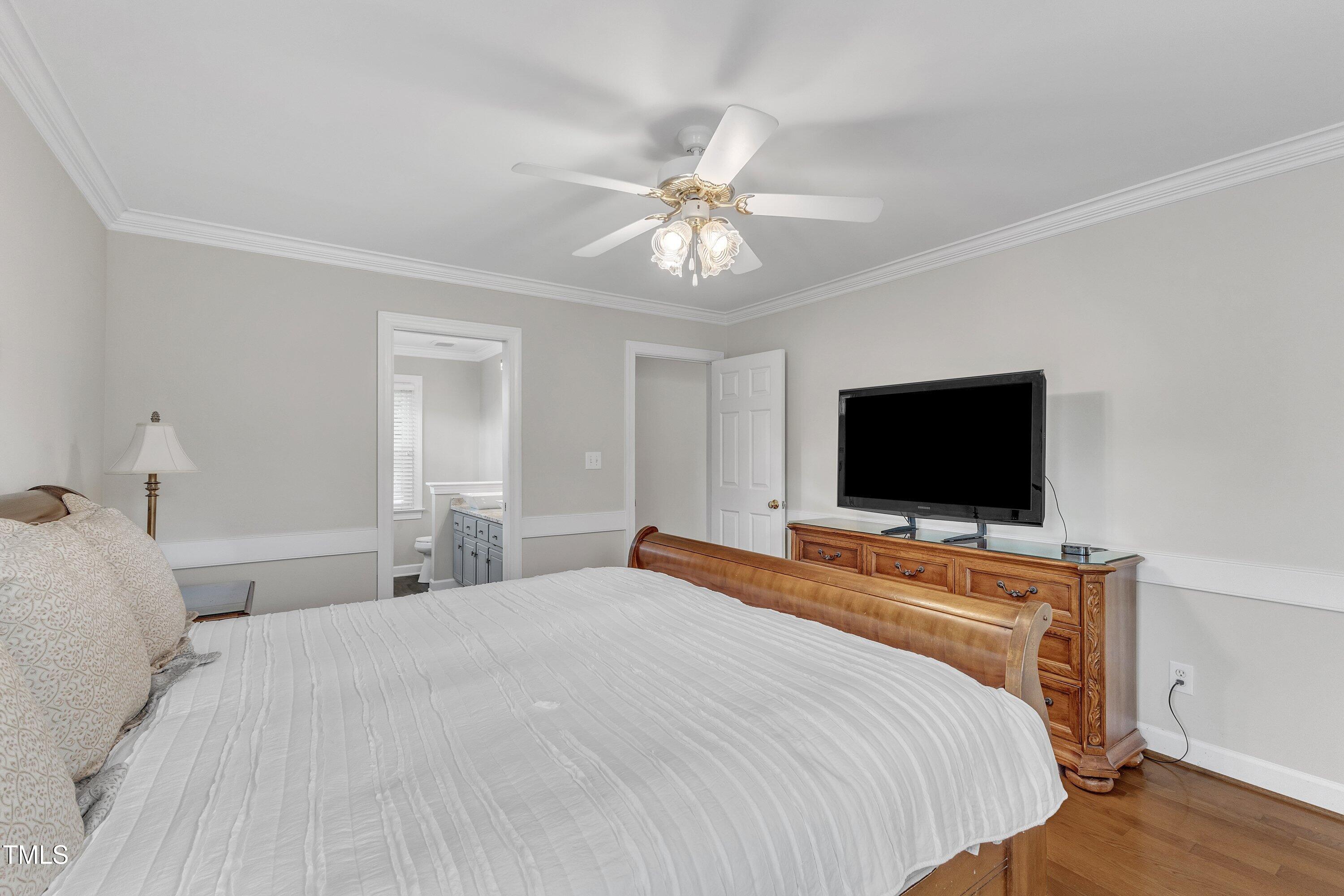 2721 Dahlgreen Road Raleigh, NC 27615 - Photo 27 of 59 a bedroom with a bed and a flat screen tv