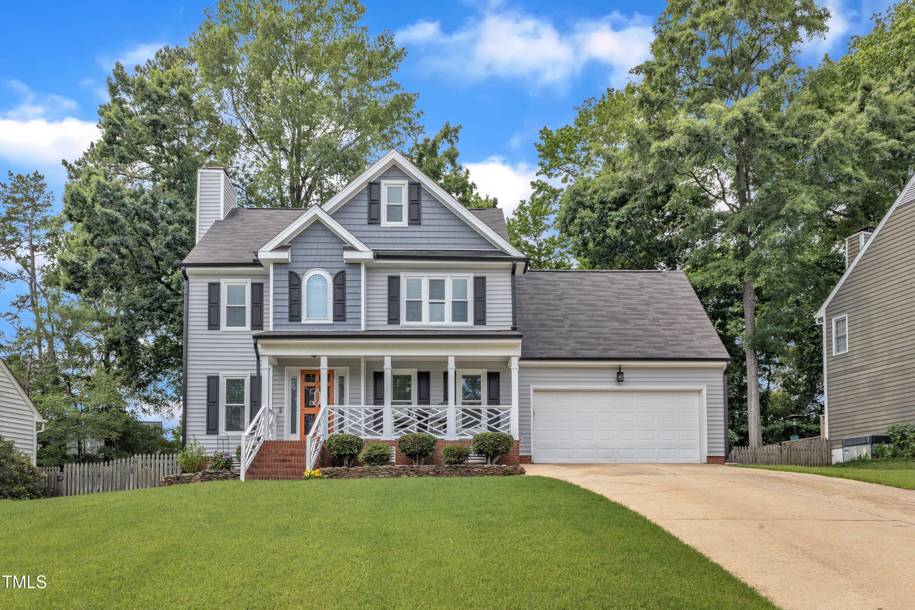 2721 Dahlgreen Road Raleigh, NC 27615 - Photo 2 of 59 a front view of a house with a yard and garage