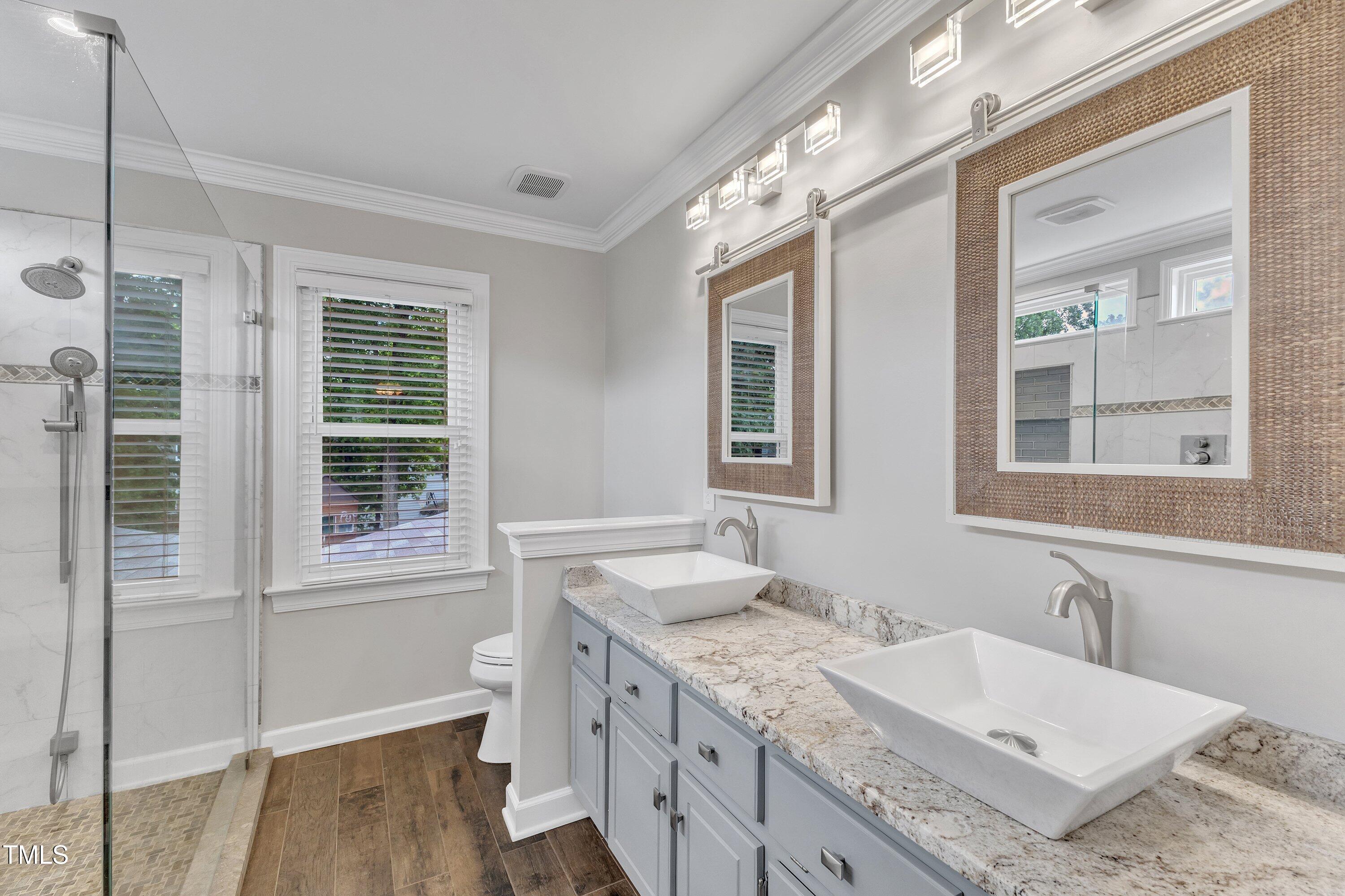 2721 Dahlgreen Road Raleigh, NC 27615 - Photo 30 of 59 a bathroom with a granite countertop sink mirror and a window