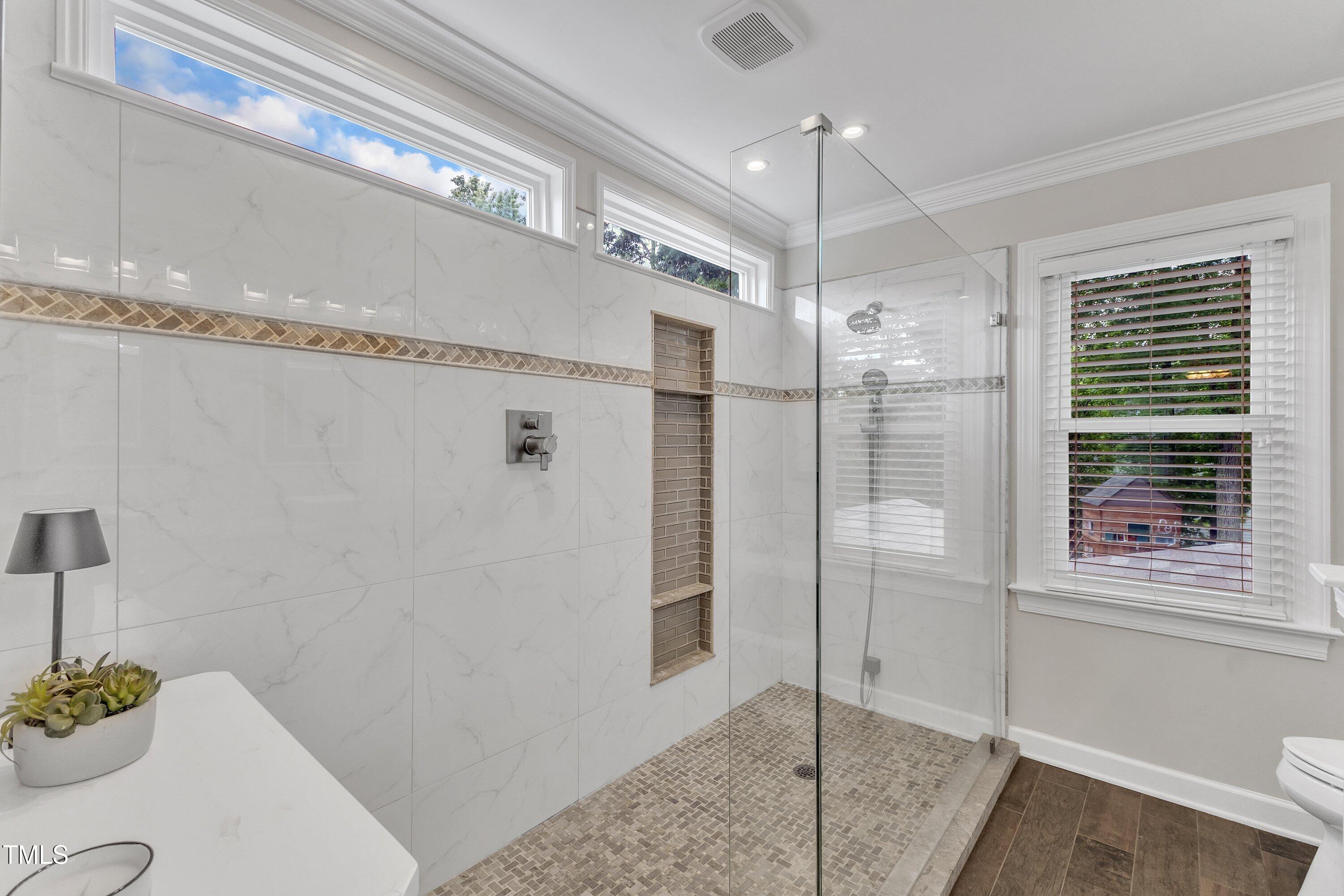 2721 Dahlgreen Road Raleigh, NC 27615 - Photo 32 of 59 a bathroom with a shower and a sink