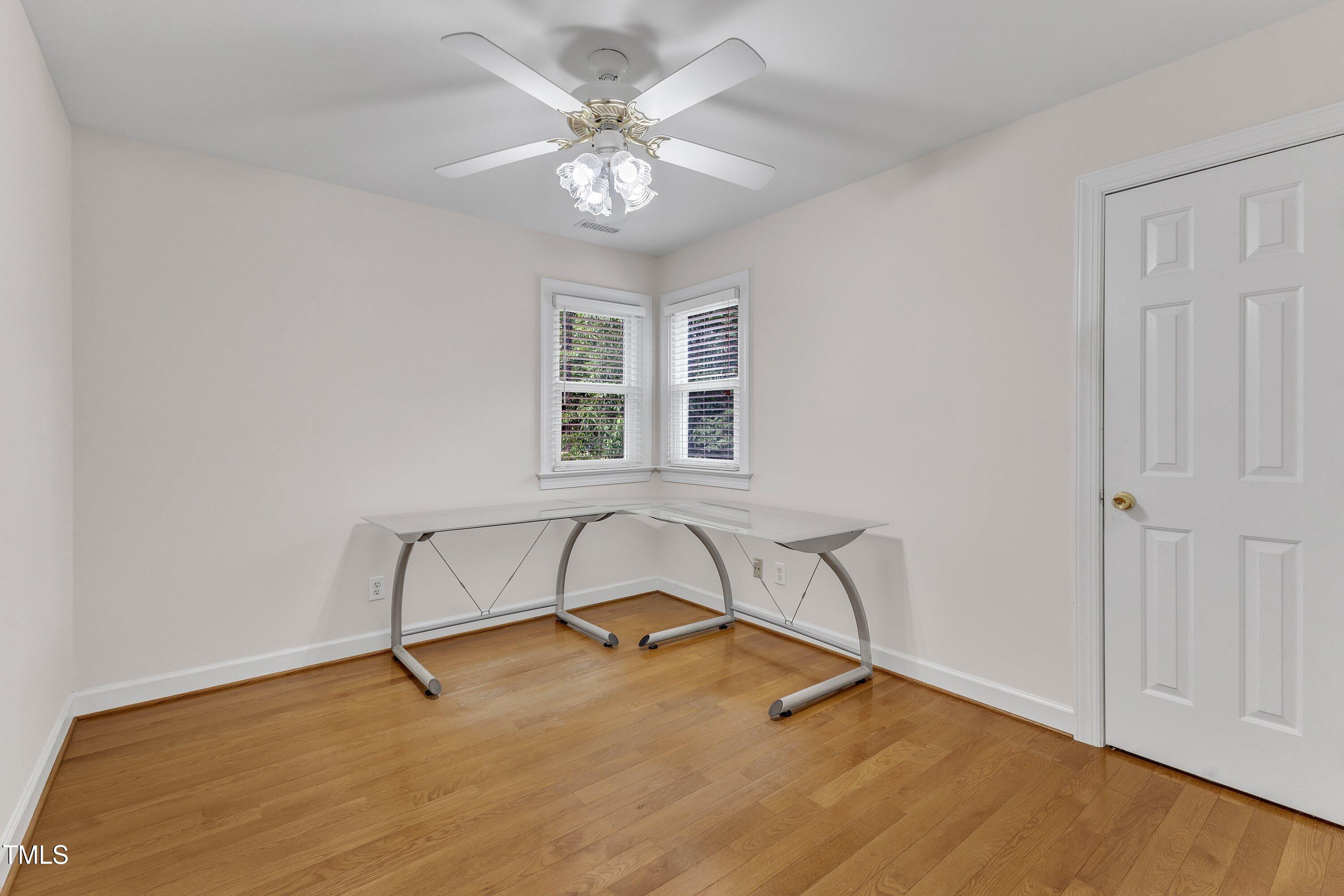 2721 Dahlgreen Road Raleigh, NC 27615 - Photo 36 of 59 a view of a room with wooden floor and fan