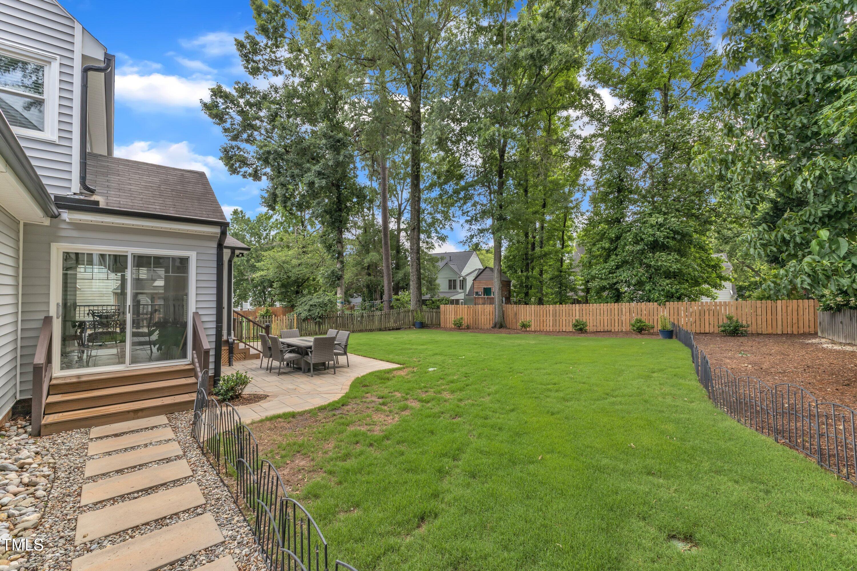 2721 Dahlgreen Road Raleigh, NC 27615 - Photo 46 of 59 a view of a patio with chairs and table and chairs and potted plants