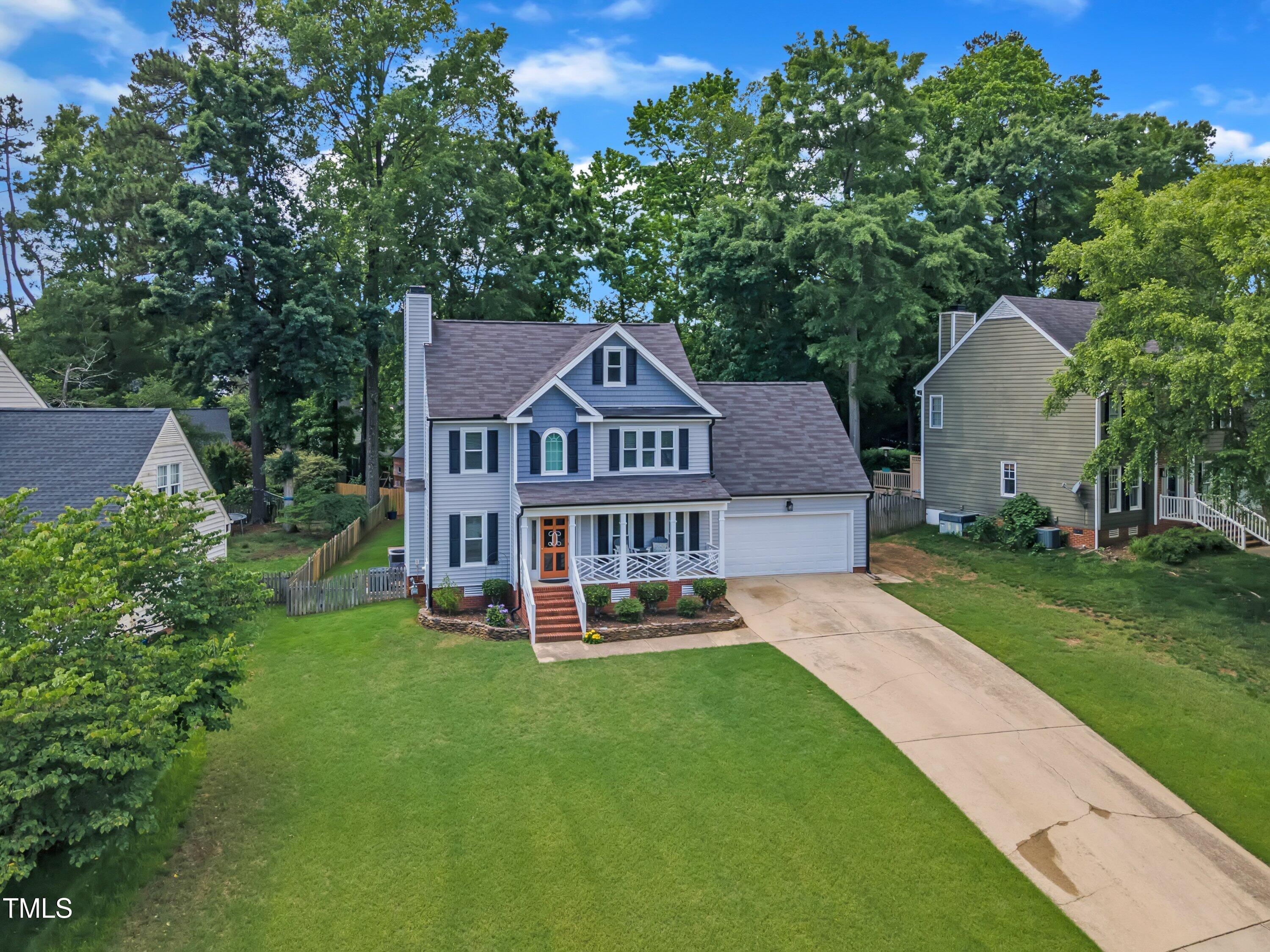 2721 Dahlgreen Road Raleigh, NC 27615 - Photo 51 of 59 a view of a house with a big yard and large trees