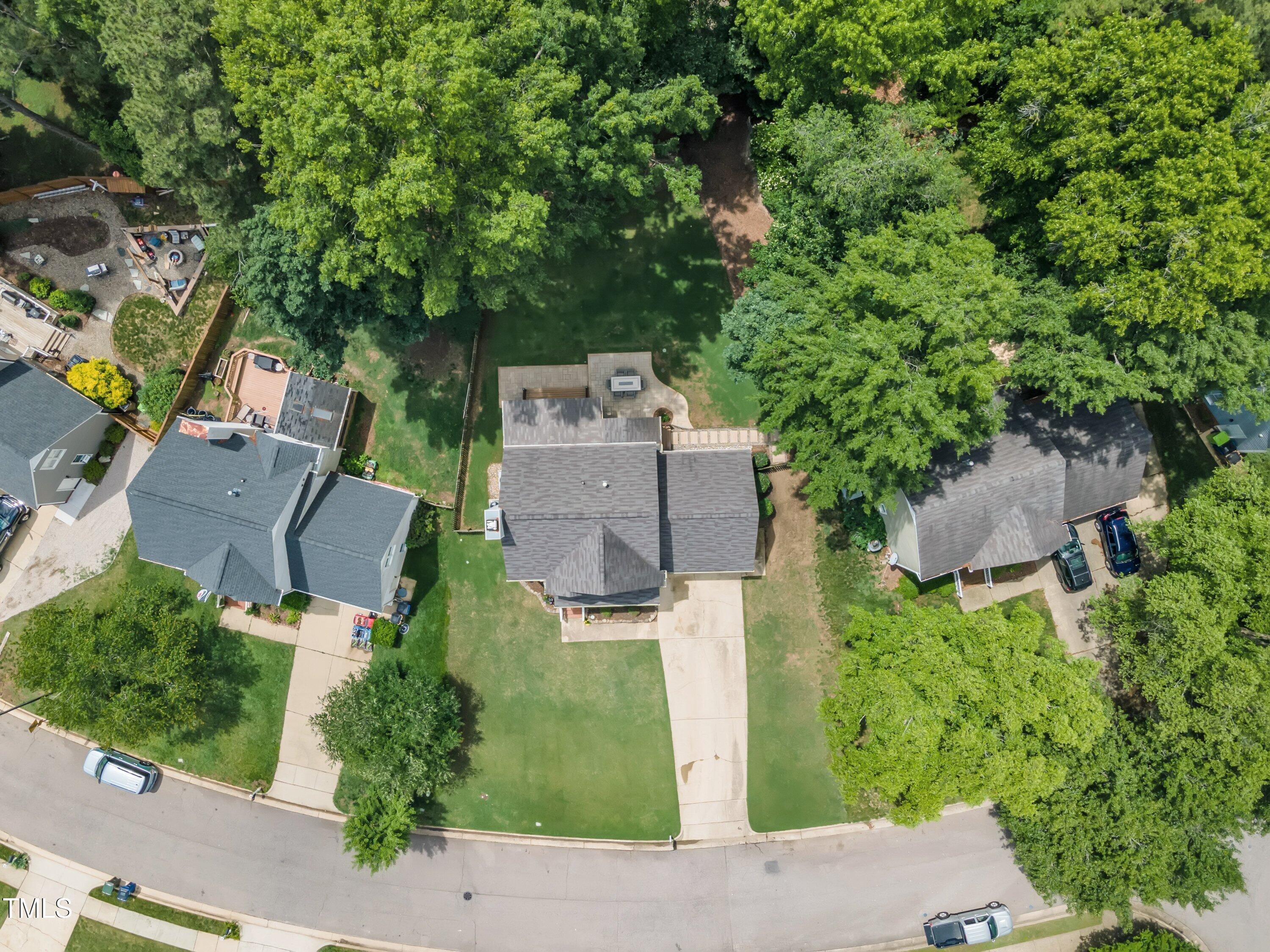 2721 Dahlgreen Road Raleigh, NC 27615 - Photo 53 of 59 an aerial view of a house with a yard and trees