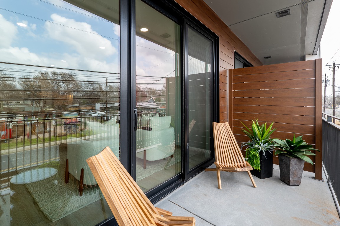 2209 South 1st Street, Unit 226 Austin, TX 78704 - Photo 12 of 27 a balcony with chairs and a potted plant