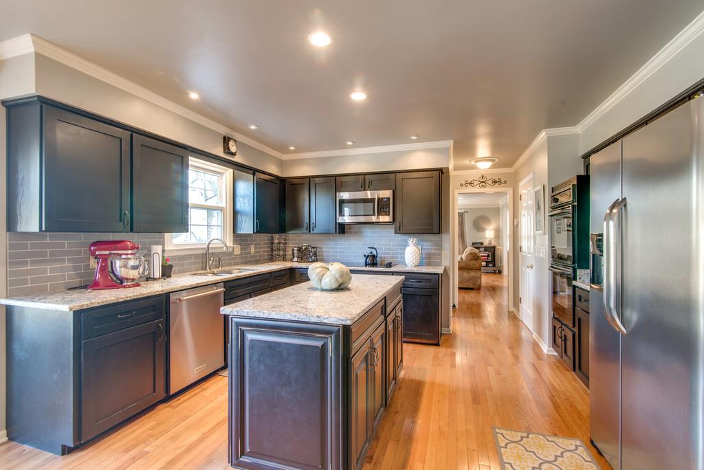 113 Shiloh Ridge Hendersonville, TN 37075 - Photo 11 of 30 a kitchen with counter top space a sink cabinets and stainless steel appliances