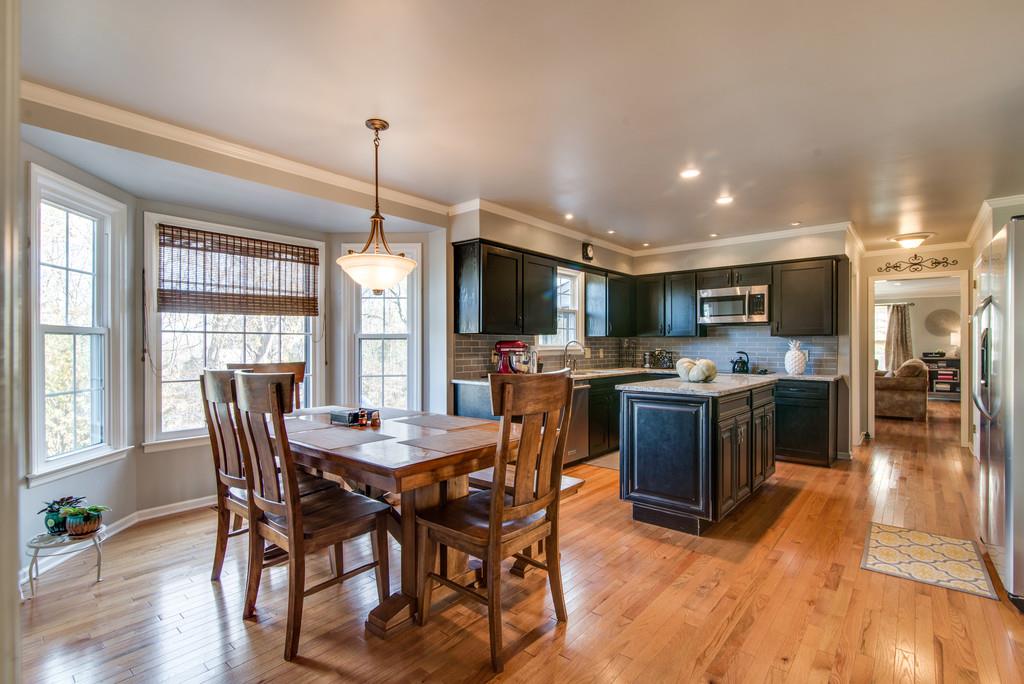 113 Shiloh Ridge Hendersonville, TN 37075 - Photo 15 of 30 a view of a dining room and livingroom with furniture wooden floor a chandelier
