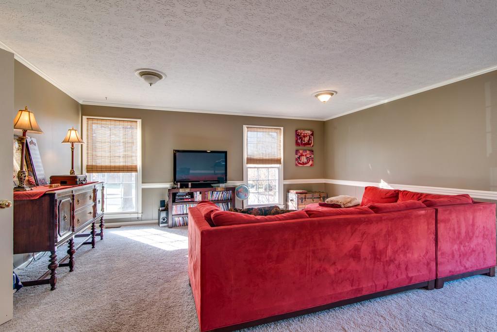 113 Shiloh Ridge Hendersonville, TN 37075 - Photo 17 of 30 a living room with furniture and a flat screen tv