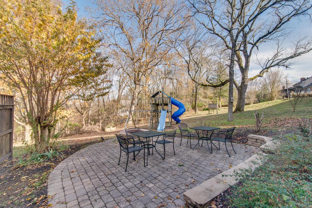 113 Shiloh Ridge Hendersonville, TN 37075 - Photo 29 of 30 a wooden bench sitting in middle of a yard