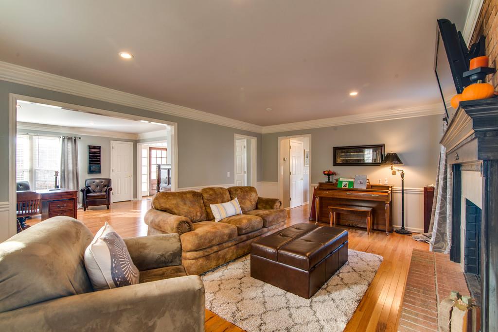 113 Shiloh Ridge Hendersonville, TN 37075 - Photo 9 of 30 a living room with furniture a flat screen tv and kitchen view