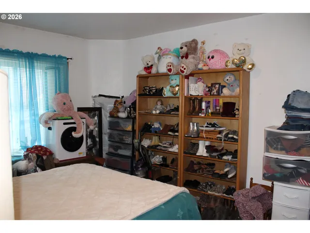 a bed room with a bed and a television