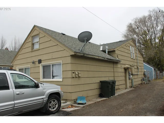 a front view of a house with parking space