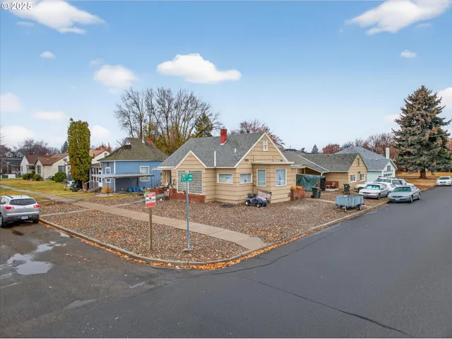 a view of a street with houses