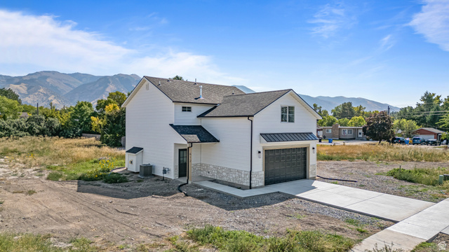 612 North 400 West Logan, UT 84321 - Photo 6 of 27 Contemporary two-story residence featuring white siding and stone veneer accents
