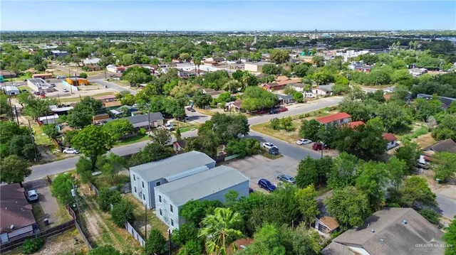 an aerial view of a house with a yard