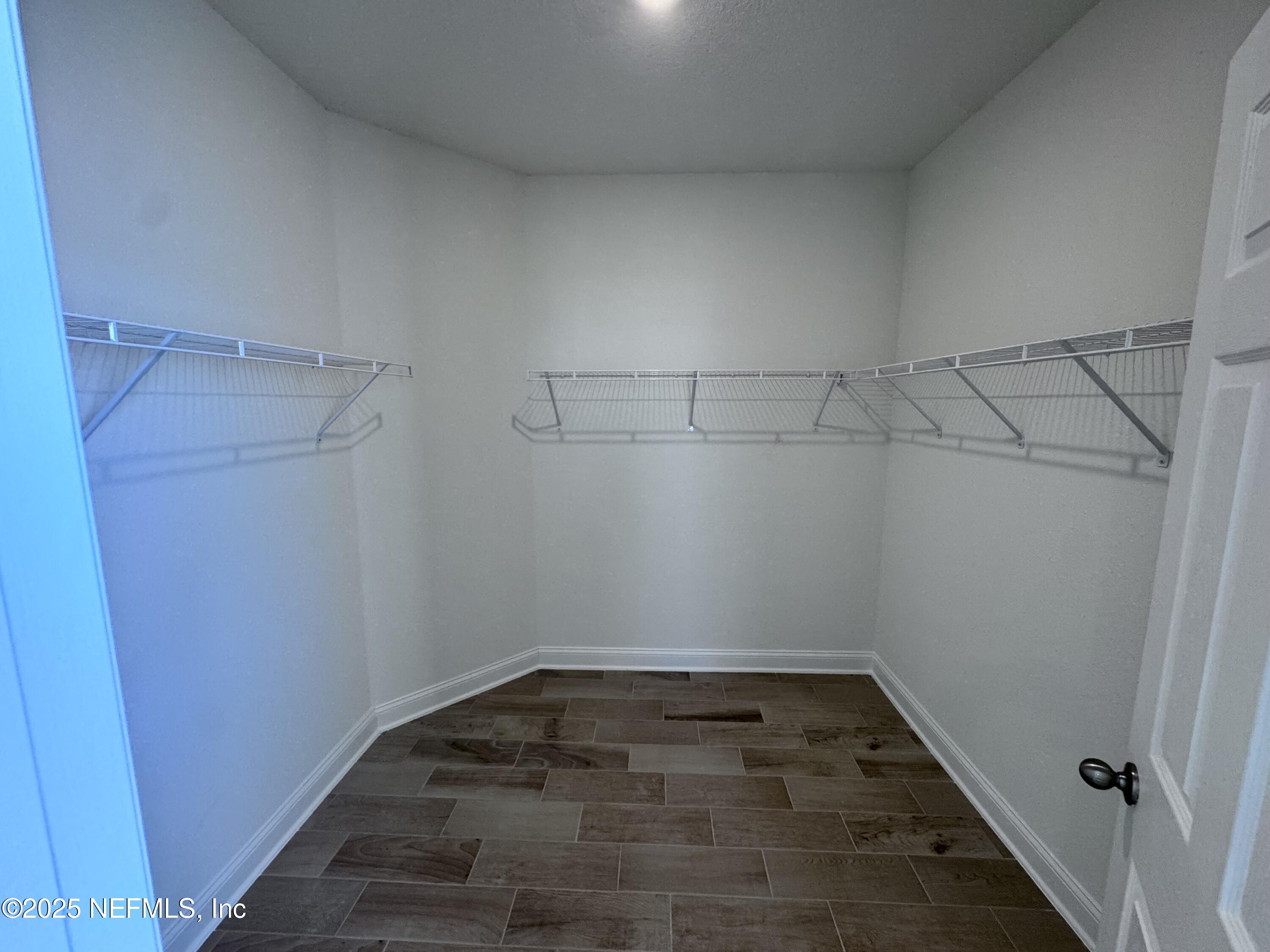 11156 Spg Mdws Road Jacksonville, FL 32222 - Photo 15 of 33 a view of a room with racks on the wall