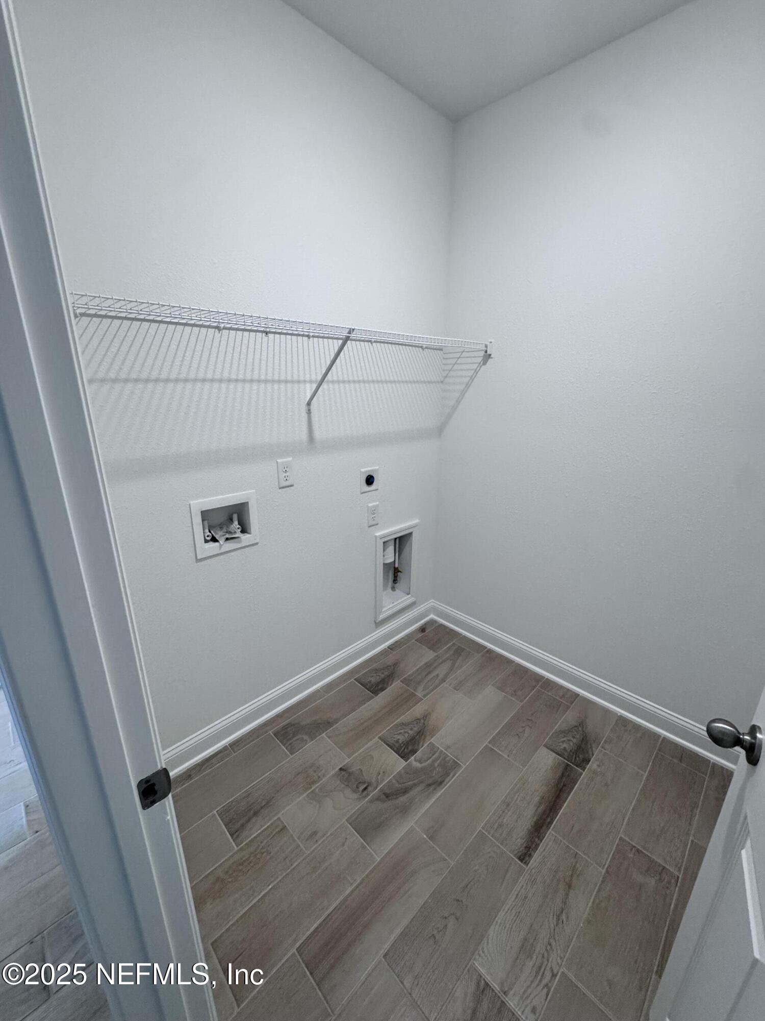 11156 Spg Mdws Road Jacksonville, FL 32222 - Photo 28 of 33 a view of a room with racks on the wall