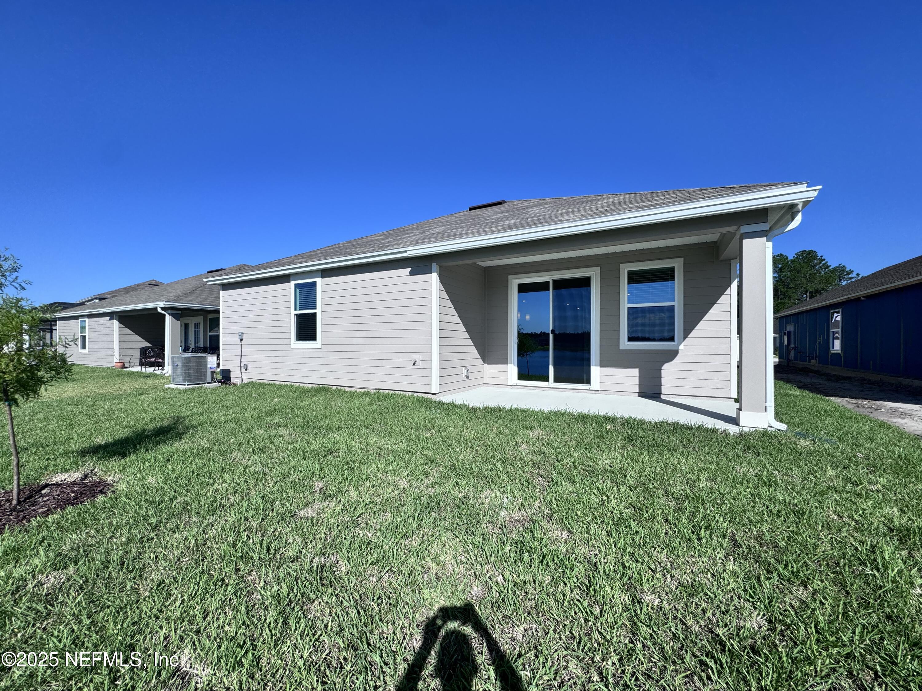 11156 Spg Mdws Road Jacksonville, FL 32222 - Photo 29 of 33 a view of a house with a backyard