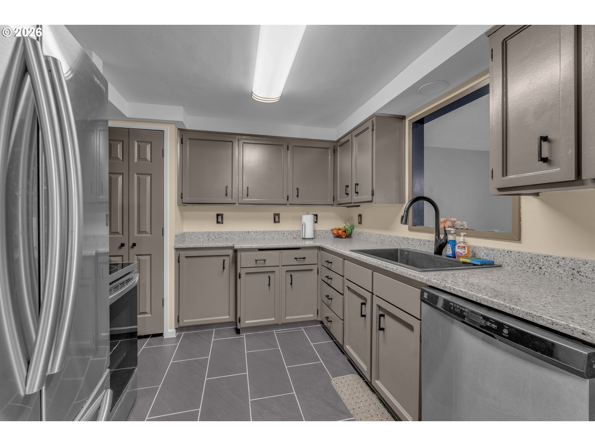 1735 Rainbow Drive Springfield, OR 97477 - Photo 7 of 17 a kitchen with a sink stainless steel appliances and cabinets