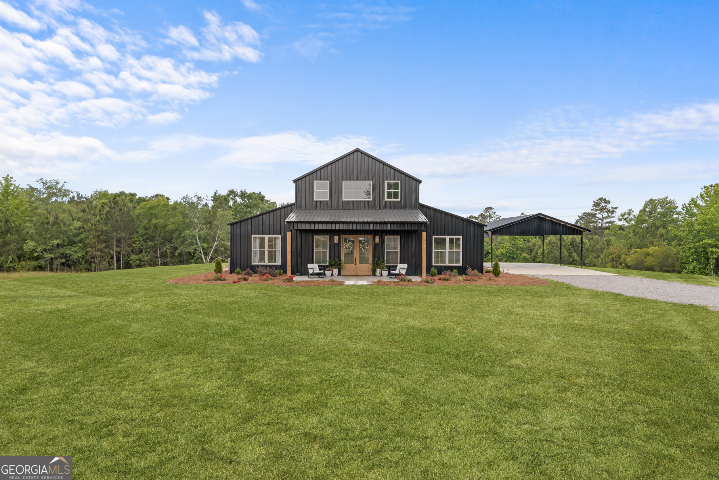 2973 Buttermilk Road Sylvania, GA 30467 - Photo 1 of 48 a front view of a house with a garden