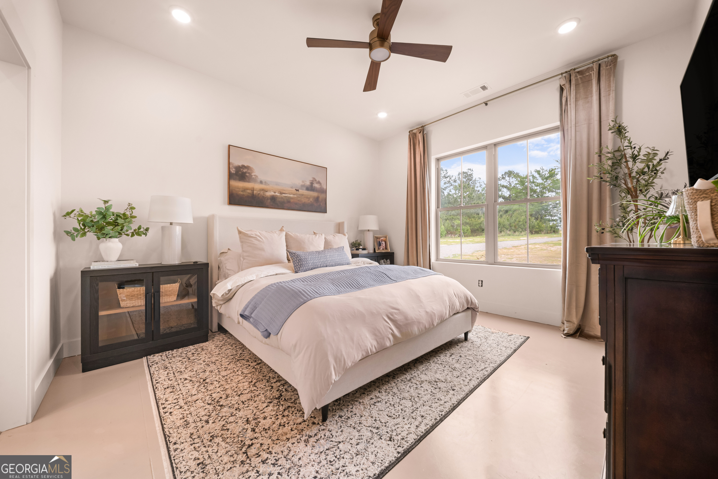 2973 Buttermilk Road Sylvania, GA 30467 - Photo 15 of 48 a bedroom with a large bed and a window