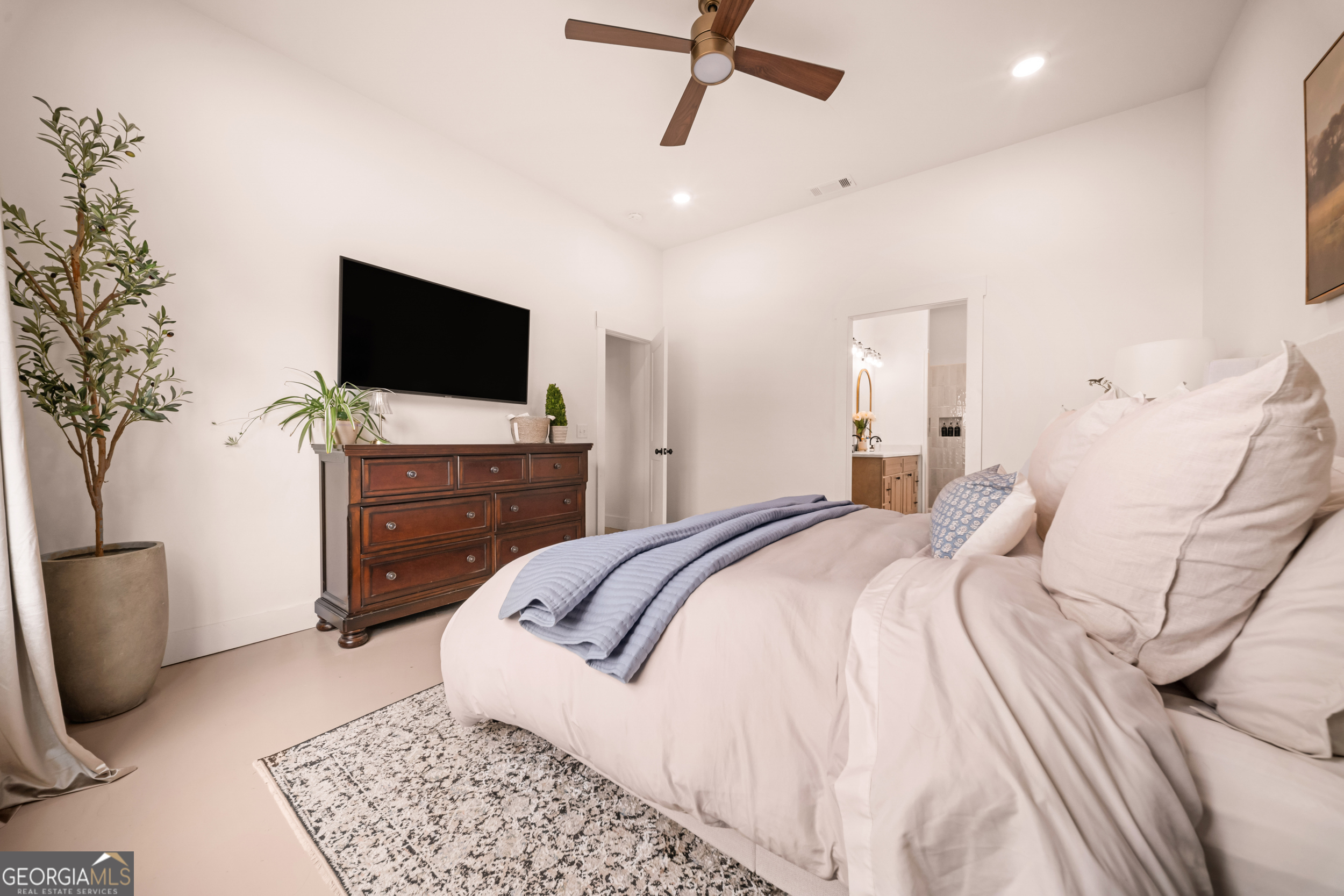 2973 Buttermilk Road Sylvania, GA 30467 - Photo 16 of 48 a bedroom with a bed and a television