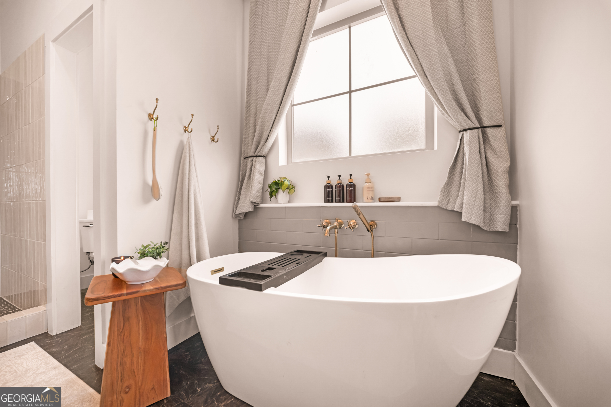 2973 Buttermilk Road Sylvania, GA 30467 - Photo 18 of 48 a white bath tub sitting in a bathroom next to a window