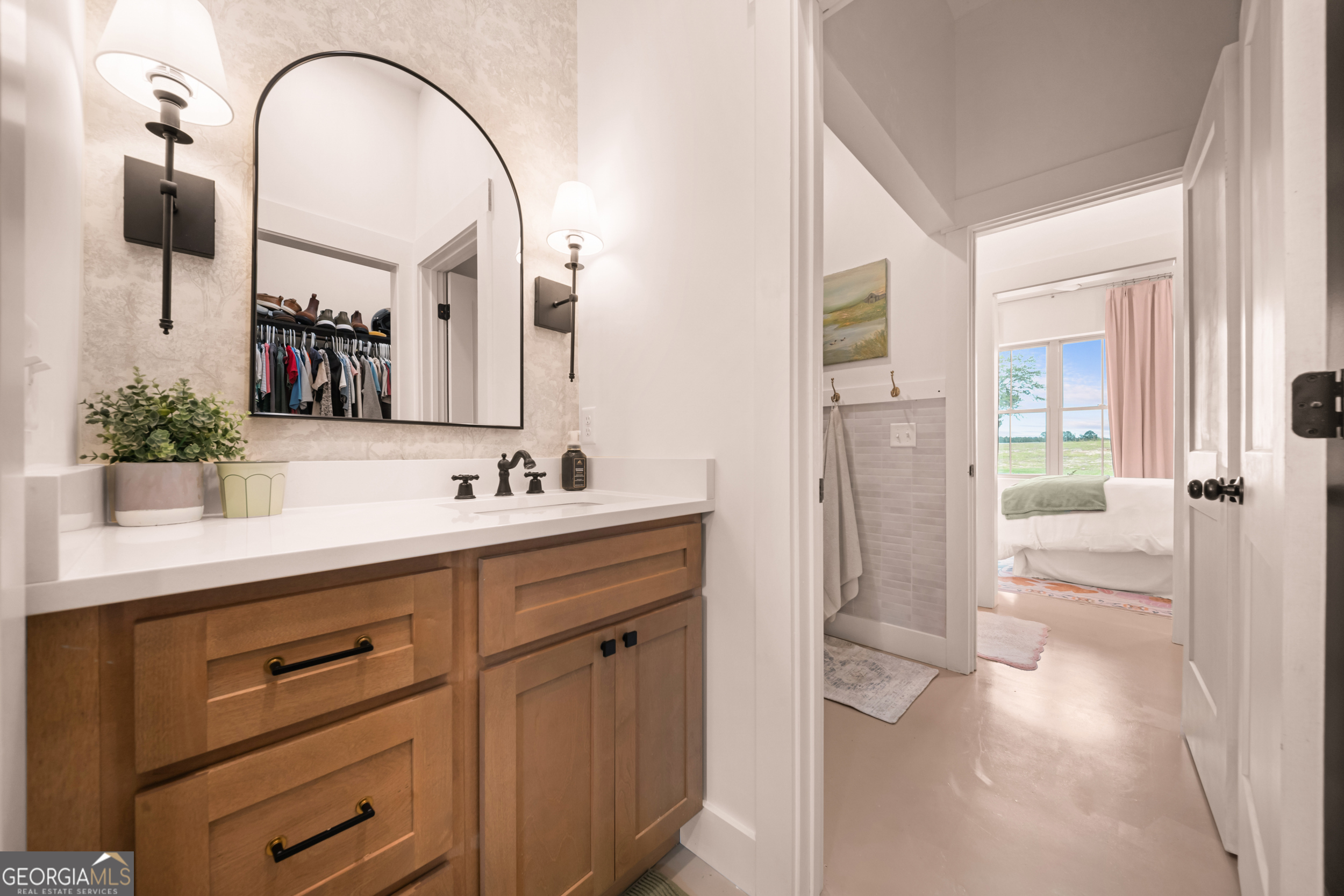 2973 Buttermilk Road Sylvania, GA 30467 - Photo 23 of 48 a spacious bathroom with a double vanity sink a mirror a shower and vanity