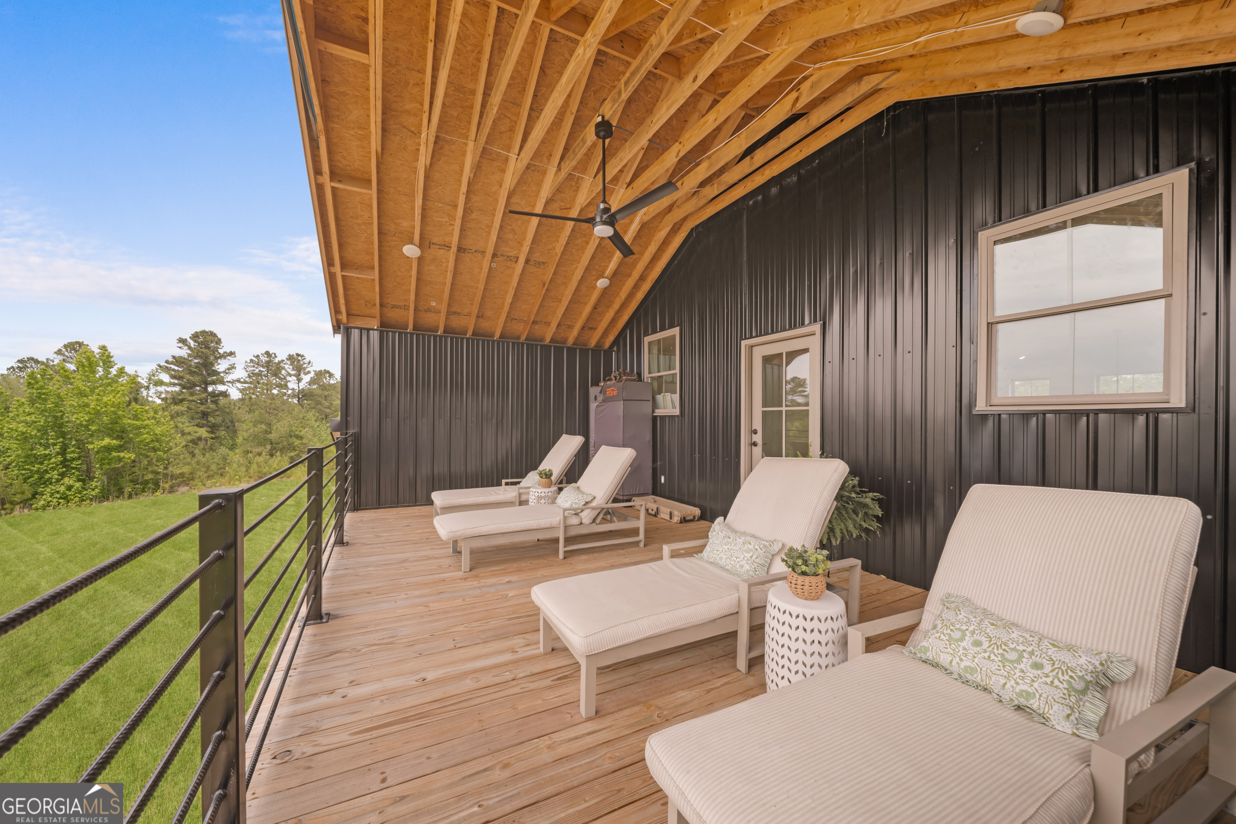 2973 Buttermilk Road Sylvania, GA 30467 - Photo 39 of 48 a balcony with wooden floor and furniture