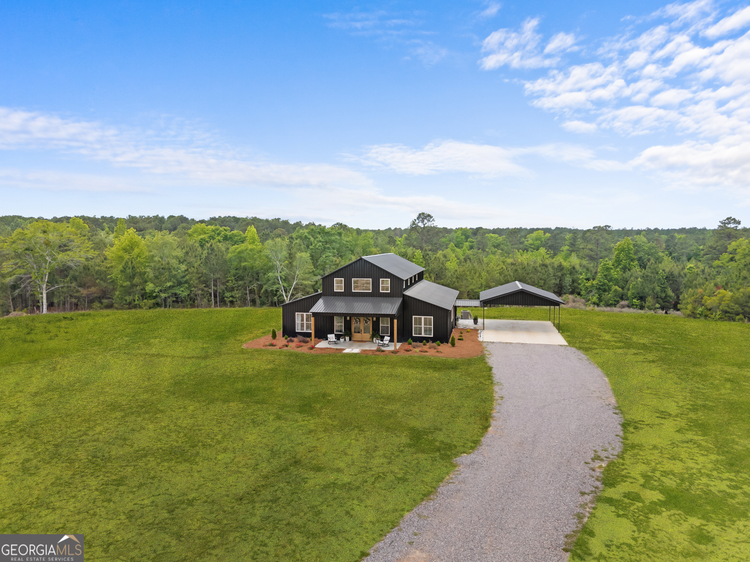 2973 Buttermilk Road Sylvania, GA 30467 - Photo 41 of 48 a view of a lake with a garden