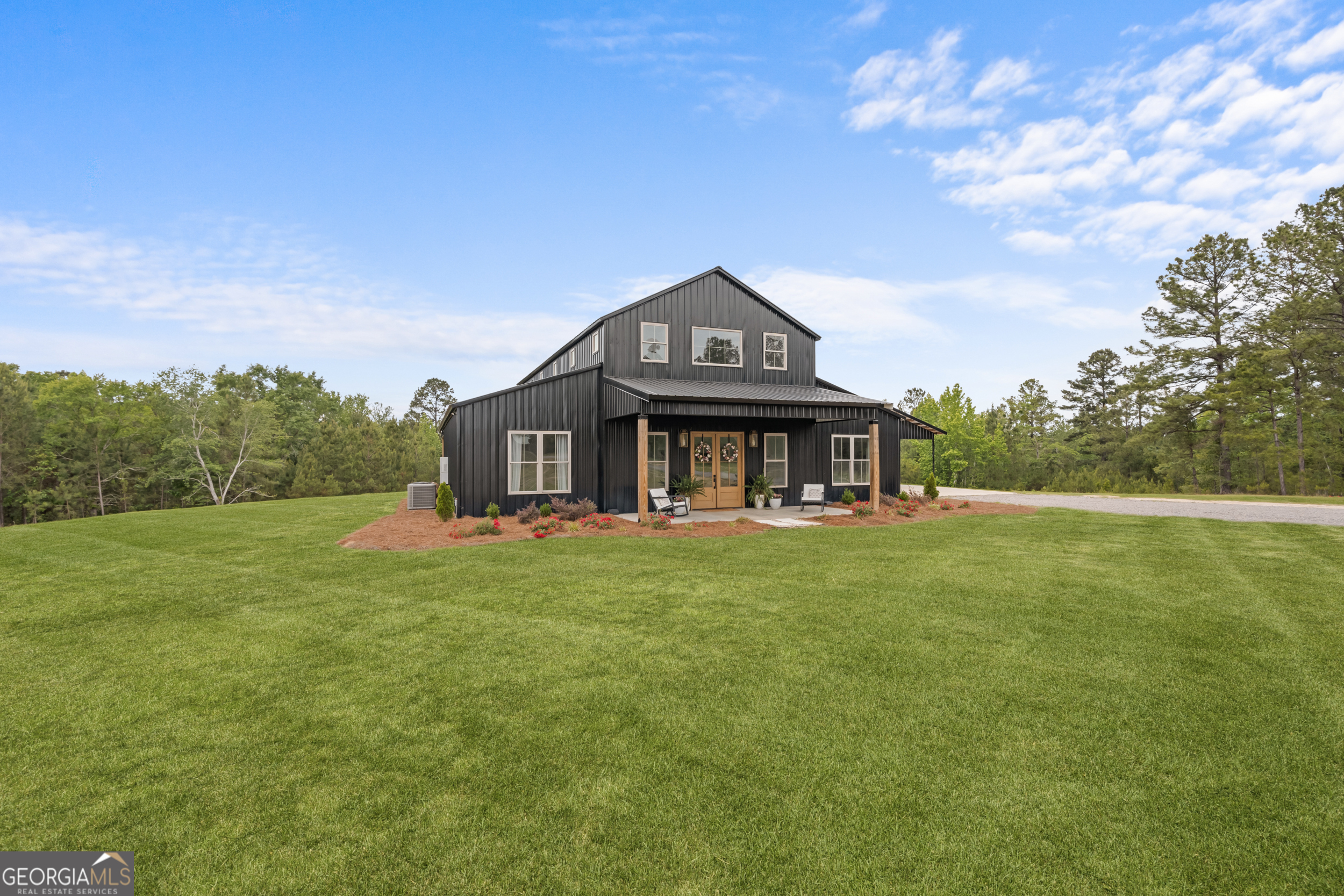 2973 Buttermilk Road Sylvania, GA 30467 - Photo 6 of 48 a view of a big house with a big yard plants and large trees