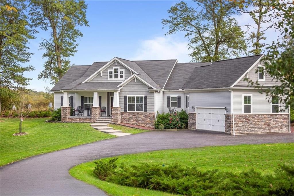 119 Caromar Drive Mars, PA 16046 - Photo 1 of 48 a front view of a house with garden