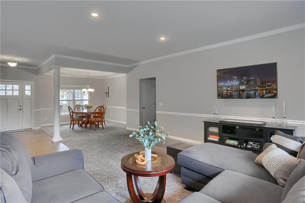 119 Caromar Drive Mars, PA 16046 - Photo 13 of 48 a living room with furniture flowerpot and a potted plant