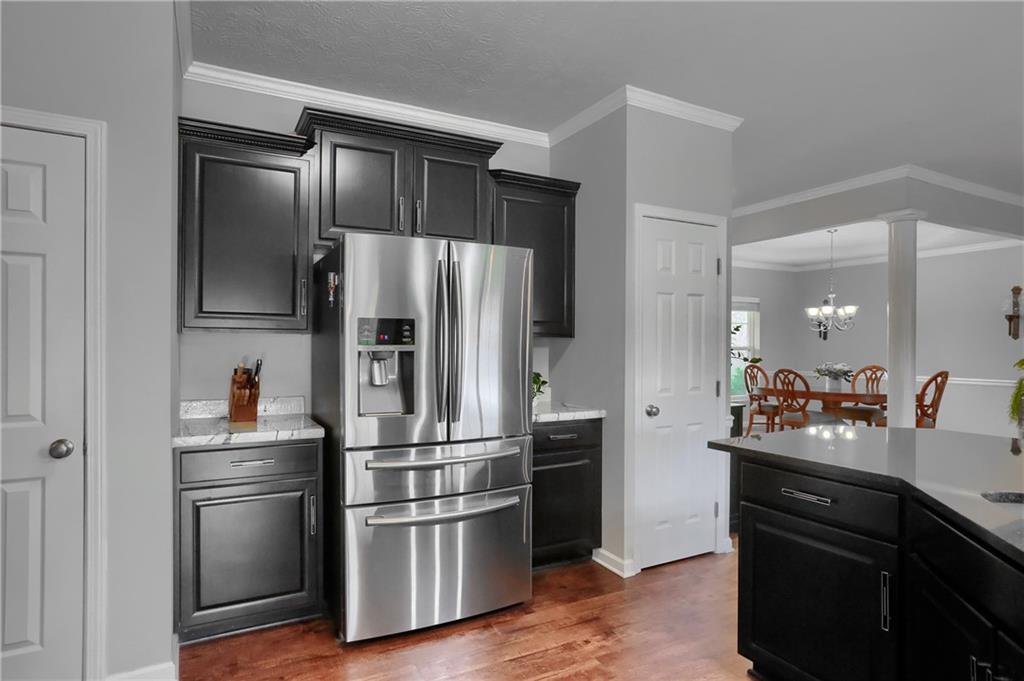 119 Caromar Drive Mars, PA 16046 - Photo 20 of 48 a kitchen with stainless steel appliances and wooden floor