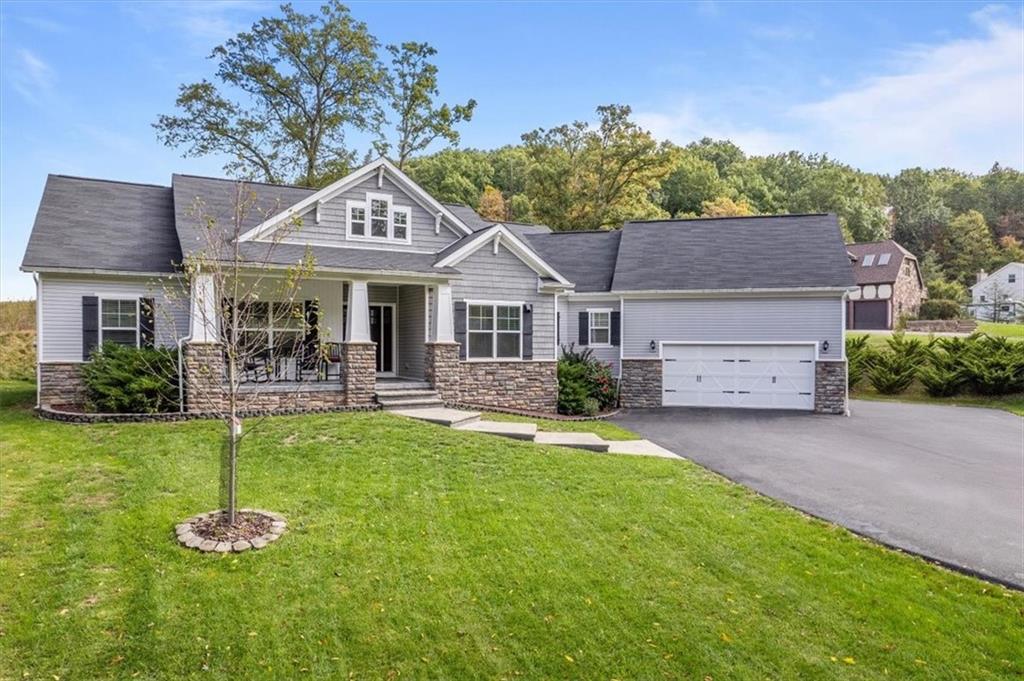 119 Caromar Drive Mars, PA 16046 - Photo 2 of 48 a front view of a house with a yard garage and outdoor seating