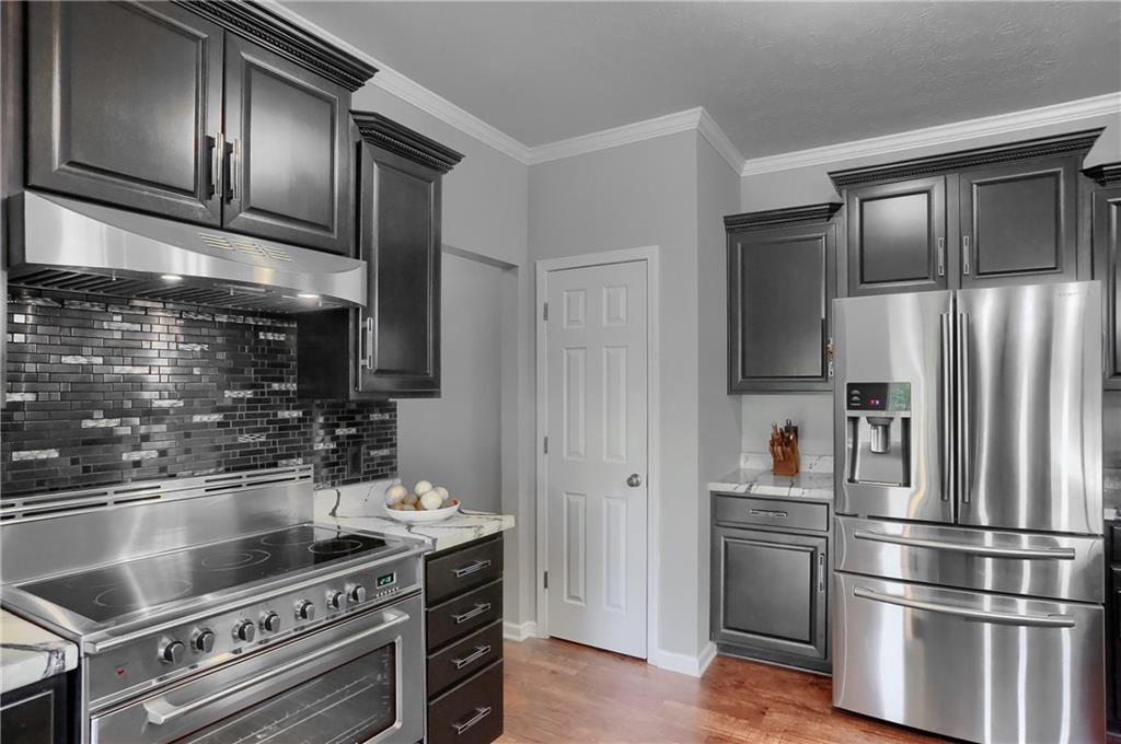 119 Caromar Drive Mars, PA 16046 - Photo 21 of 48 a kitchen with granite countertop stainless steel appliances and wooden cabinets