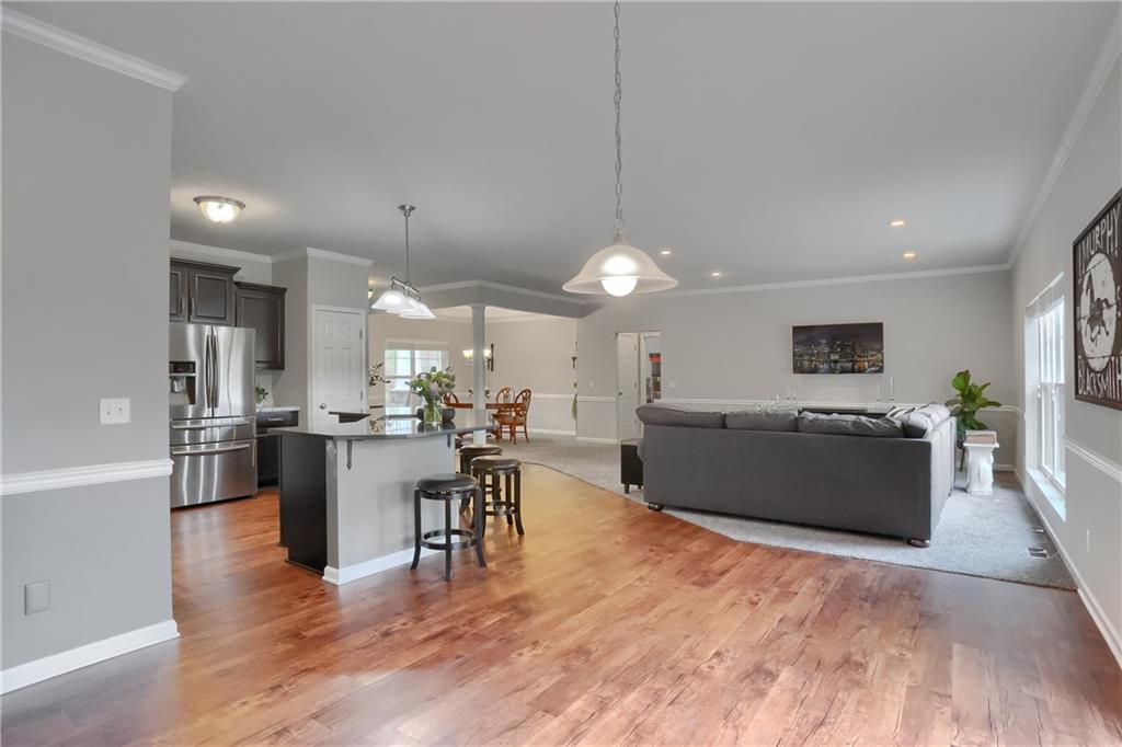 119 Caromar Drive Mars, PA 16046 - Photo 23 of 48 a living room with furniture a wooden floor and a sink