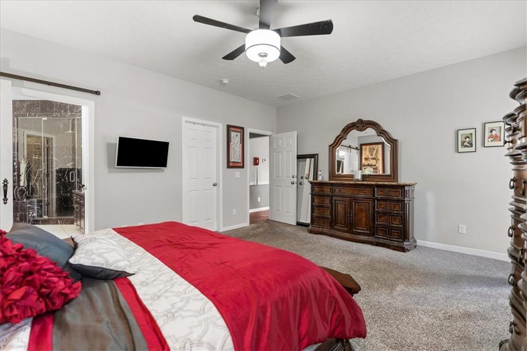 119 Caromar Drive Mars, PA 16046 - Photo 29 of 48 a spacious bedroom with a bed a dresser and flat screen tv