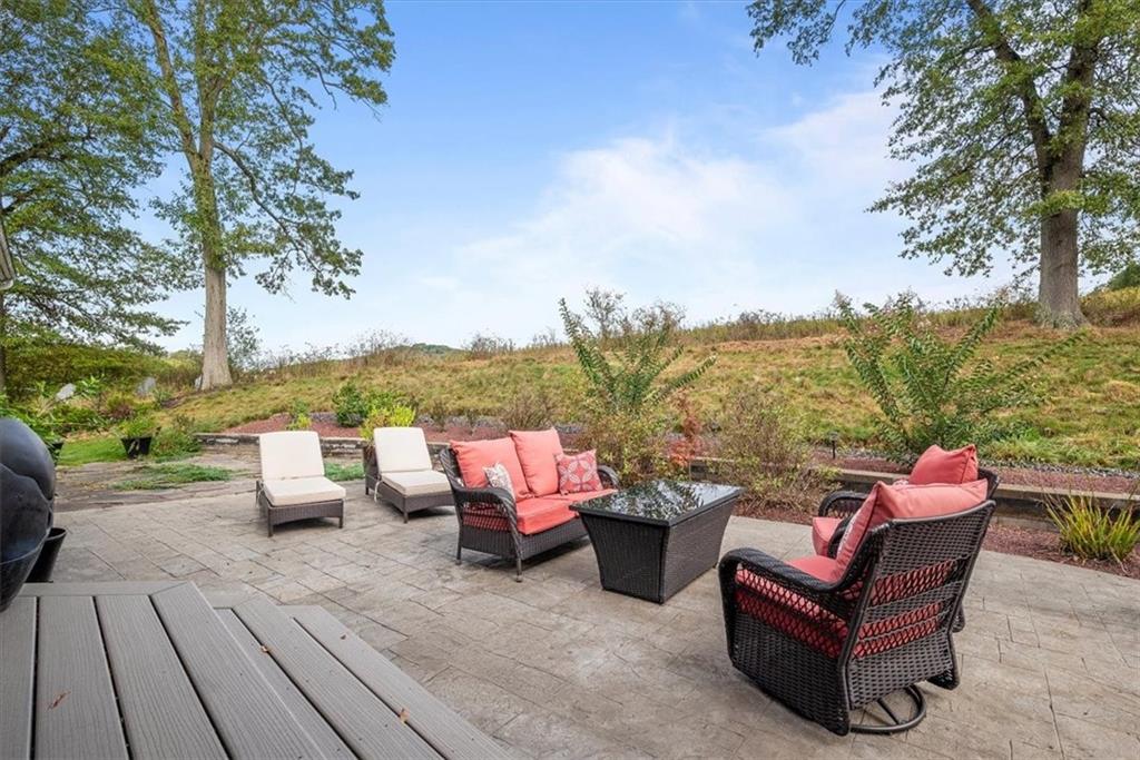 119 Caromar Drive Mars, PA 16046 - Photo 40 of 48 an outdoor sitting area with couch and a fire pit