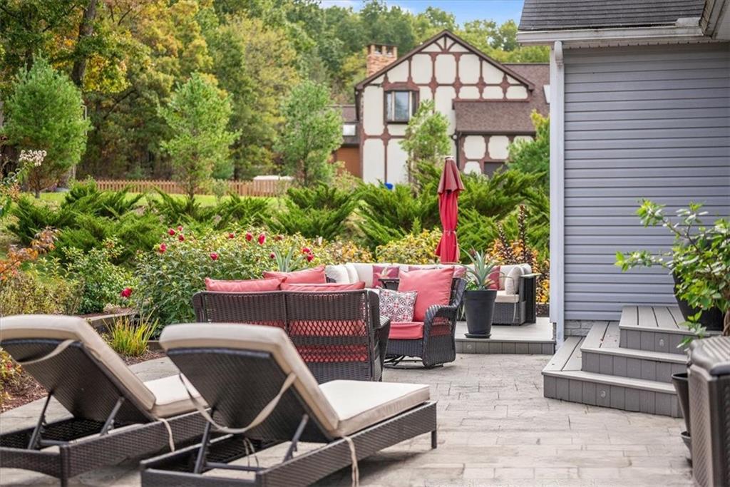 119 Caromar Drive Mars, PA 16046 - Photo 42 of 48 a view of a chairs and table in the back yard of a house