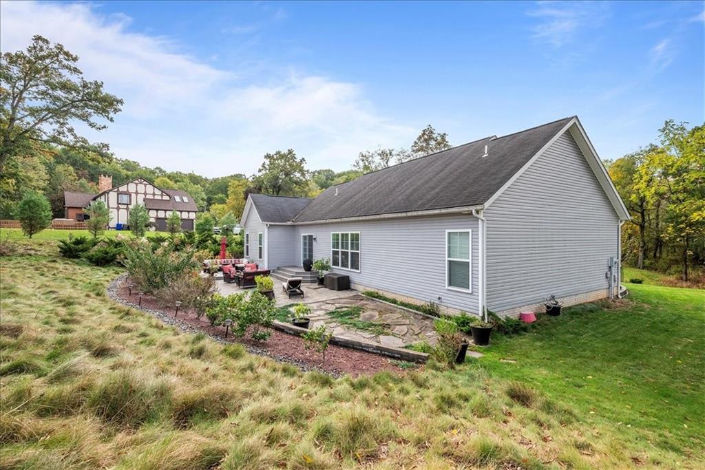 119 Caromar Drive Mars, PA 16046 - Photo 45 of 48 a view of a house with sitting area and garden