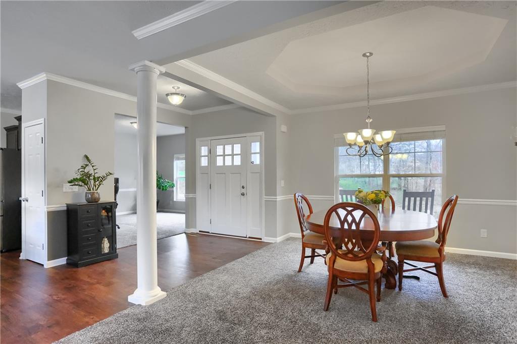 119 Caromar Drive Mars, PA 16046 - Photo 5 of 48 a view of a dining room and livingroom furniture wooden floor a chandelier and a rug