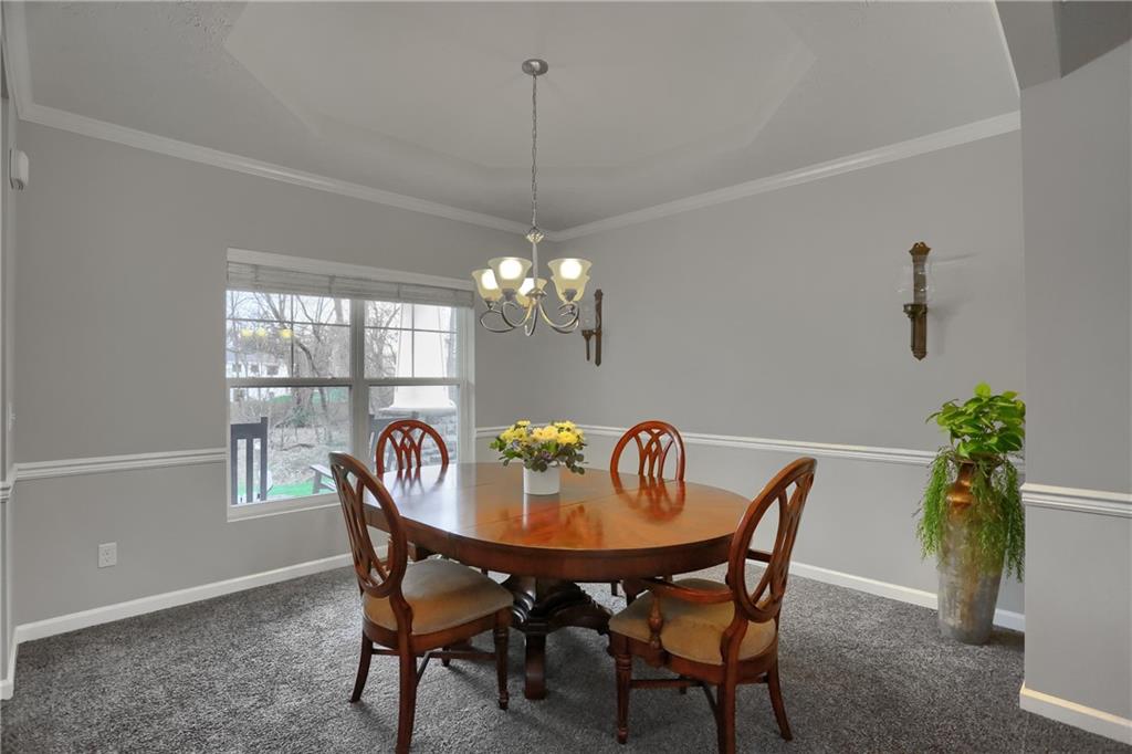 119 Caromar Drive Mars, PA 16046 - Photo 6 of 48 a dining room with furniture a potted plant and a chandelier