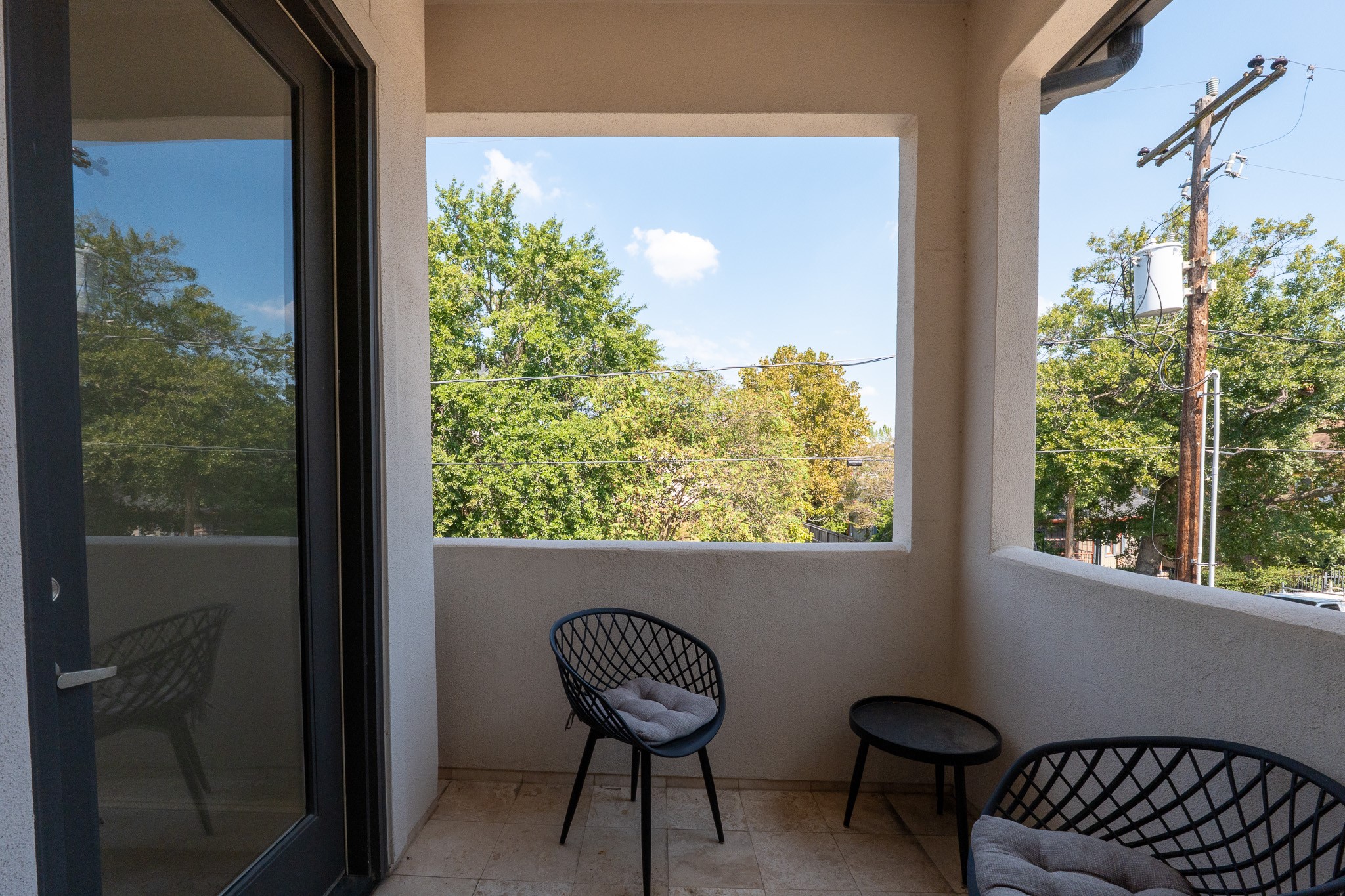 1409 Indiana Street Houston, TX 77006 - Photo 30 of 47 a view of a chair and table in a balcony