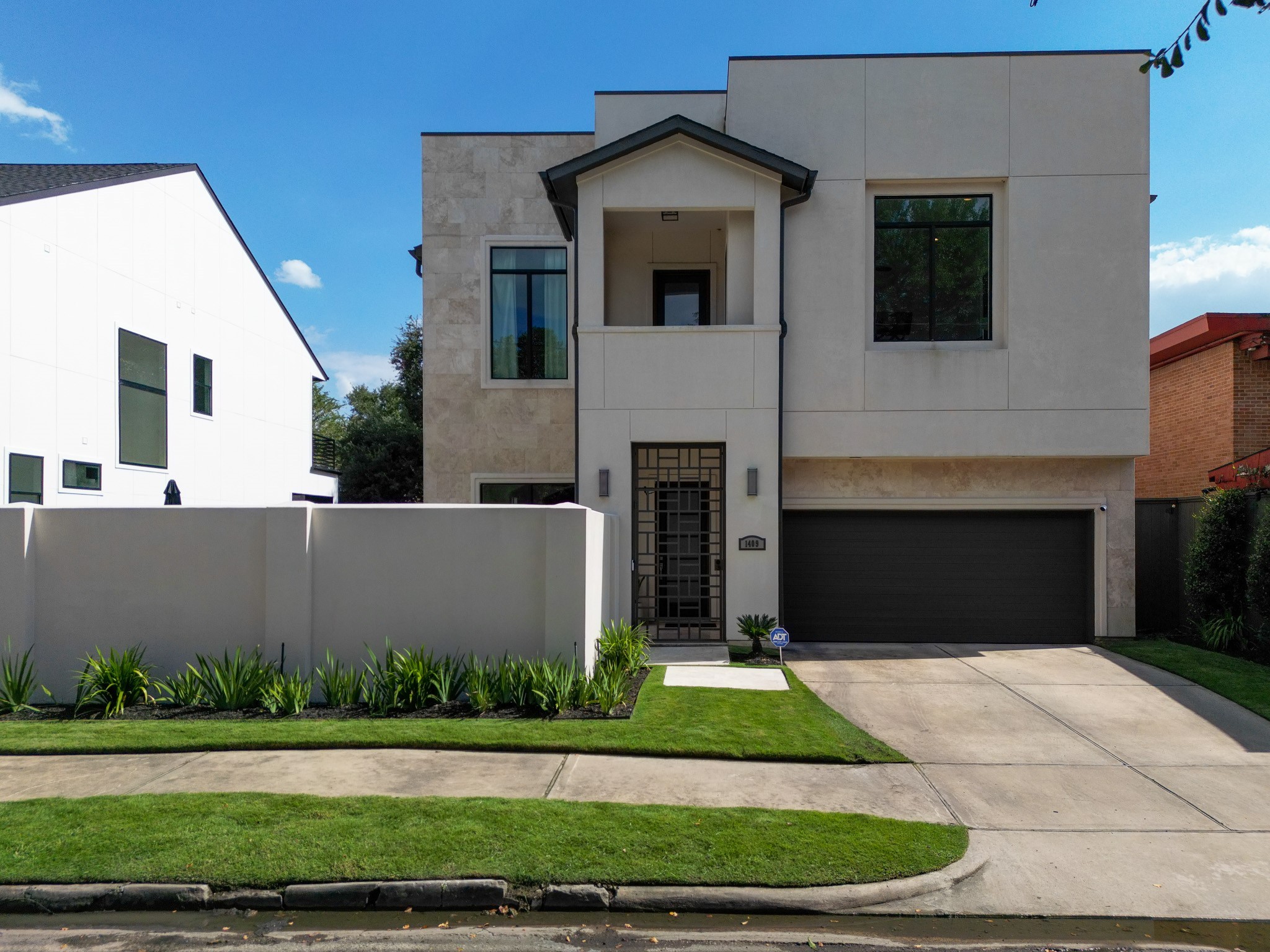 1409 Indiana Street Houston, TX 77006 - Photo 45 of 47 a front view of a house with a yard and garage