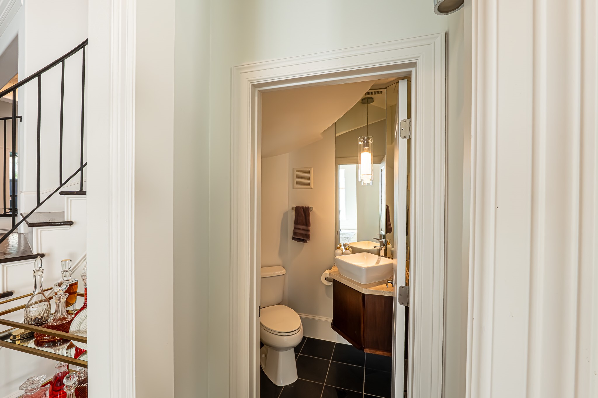 1409 Indiana Street Houston, TX 77006 - Photo 8 of 47 a bathroom with a toilet sink and mirror