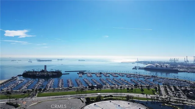 an aerial view of a house with a swimming pool outdoor seating and yard