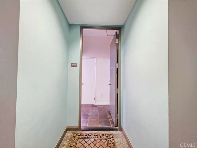 a kitchen with granite countertop a refrigerator and a stove